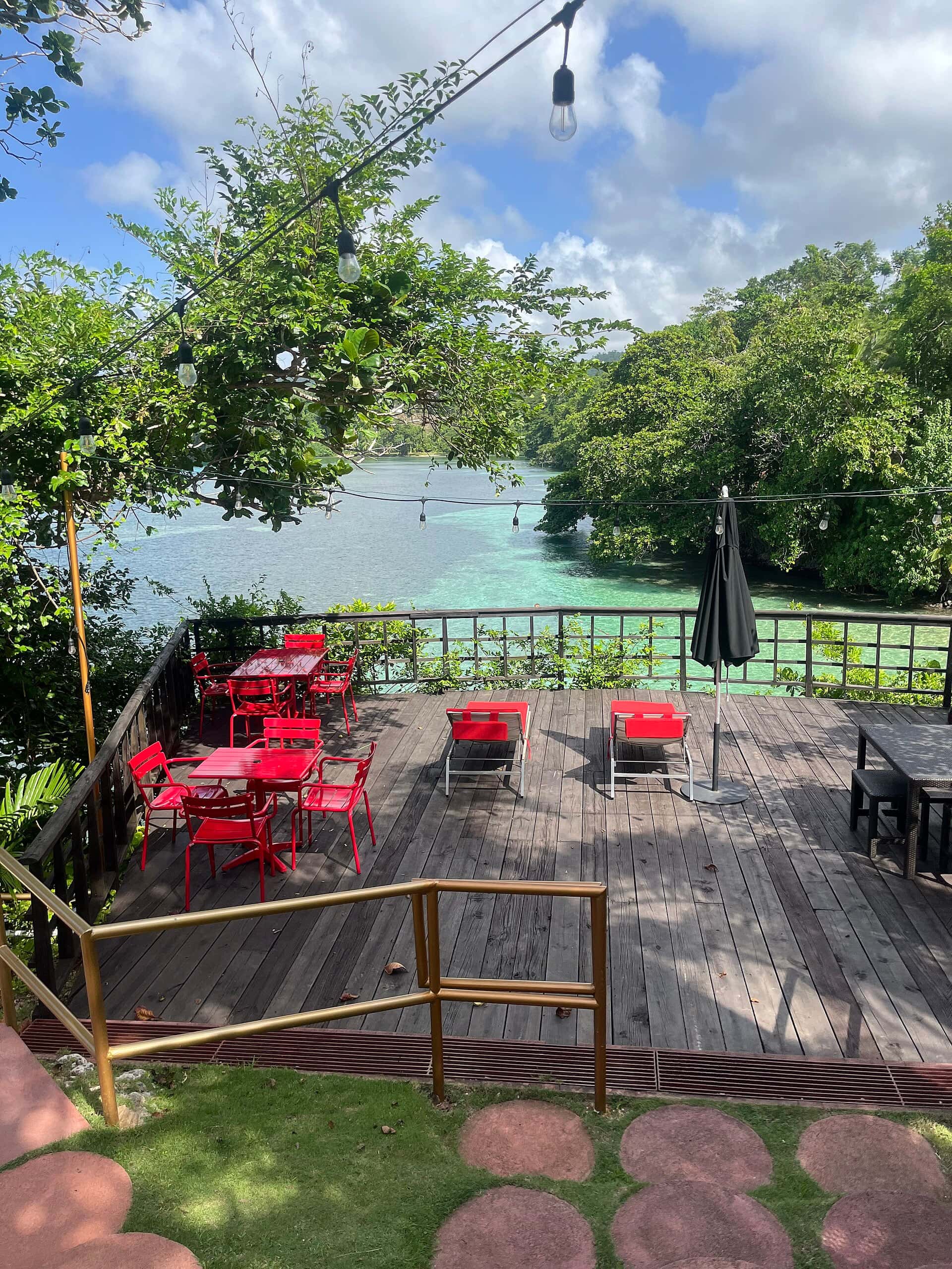 Deck overlooking turquoise water at Geejam, Port Antonio